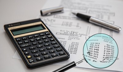 image of a calculator and bills