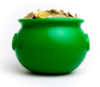 A green cauldron style pot full of gold coins 