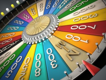 A brightly coloured (wheel of chance style) wheel with the wheel having stopped  on the win slot 