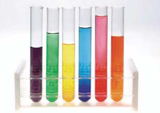 Test tubes with brightly coloured liquid in them (purple, green, yellow, blue, pink and orange)