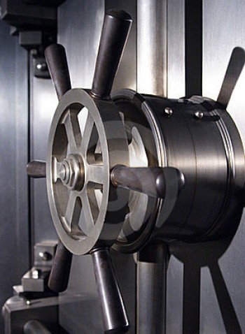 A large wheel lock on a bank vault