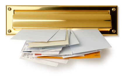 a gold letter slot with mail sticking through it on a white background 