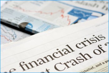  A pile of news papers with the headline “ financial crisis….crash of…”