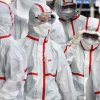 image of health care workers in protective suits